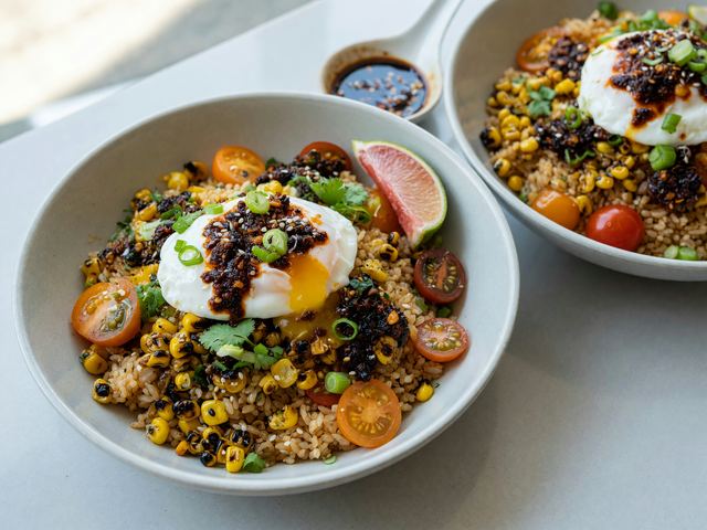 Chili-Crisp Soft Eggs with Charred Corn & Tomato Rice Bowls